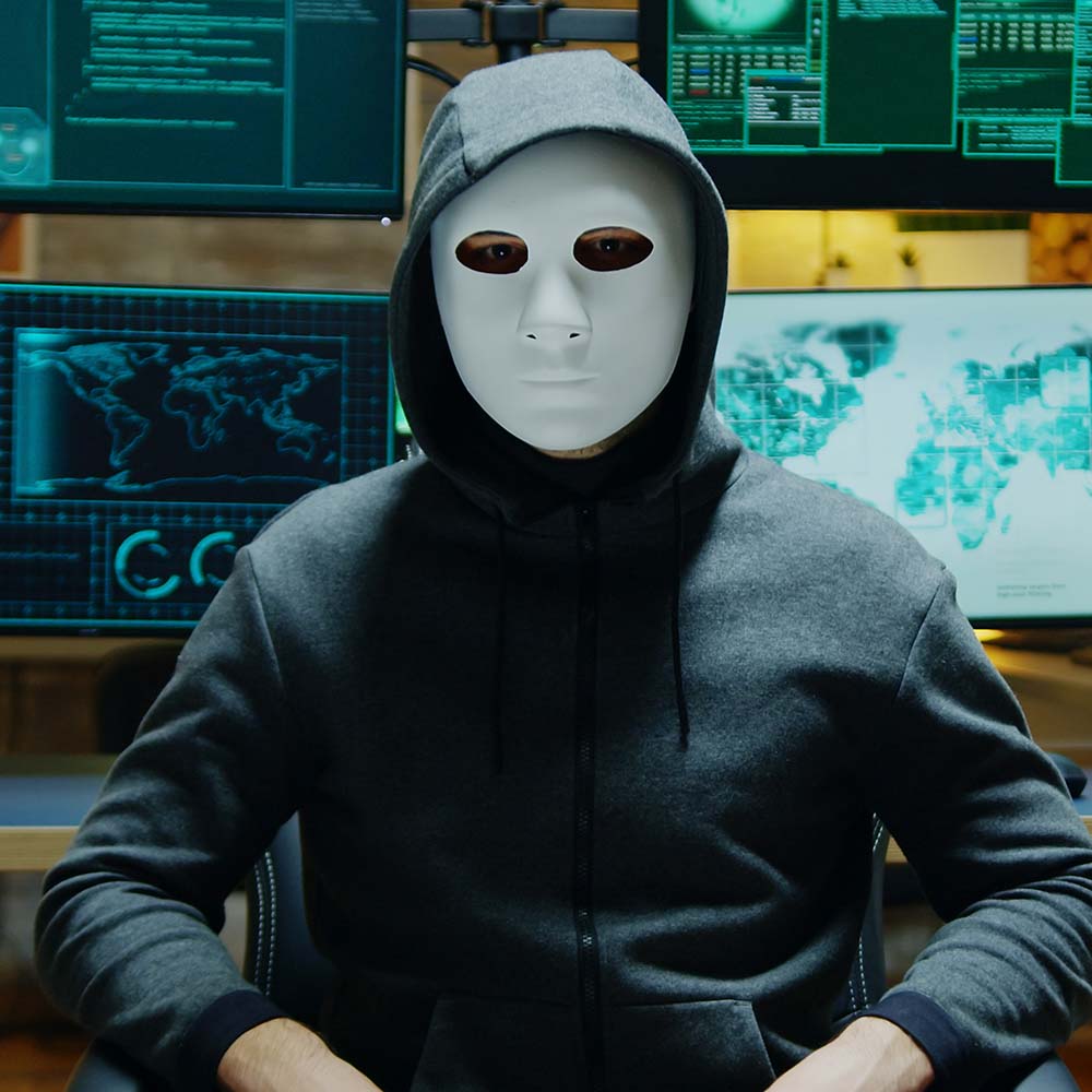 dangerous-hacker-hiding-his-identity-wearing-a-whi-FR8QEBC.jpg